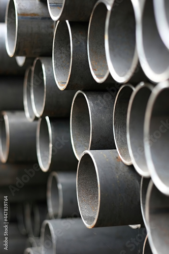 Stack of metal, steel pipes on warehouse