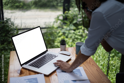 Close-up of a businesswoman using a laptop computer to audit the company's budget. Tax information is calculated by accountants