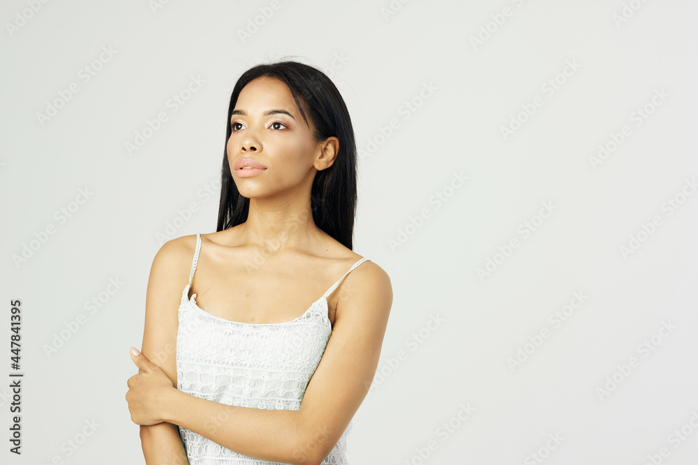 woman of african appearance corrects her hairstyle makeup clean skin woman of african appearance corrects her hairstyle makeup clean skin