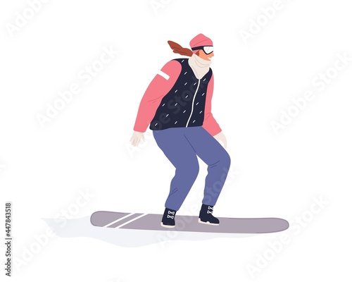 Happy female snowboarder riding snowboard. Active person sliding on snow boar...