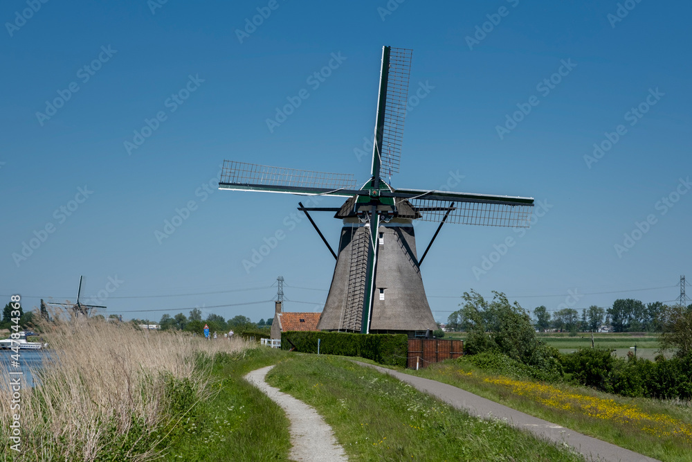 Old windmill on a canal in the Netherlands