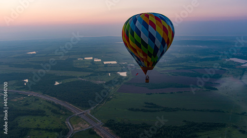 color hot air balloon in sky cloud and sunrise background at the morning time  © suvorovalex