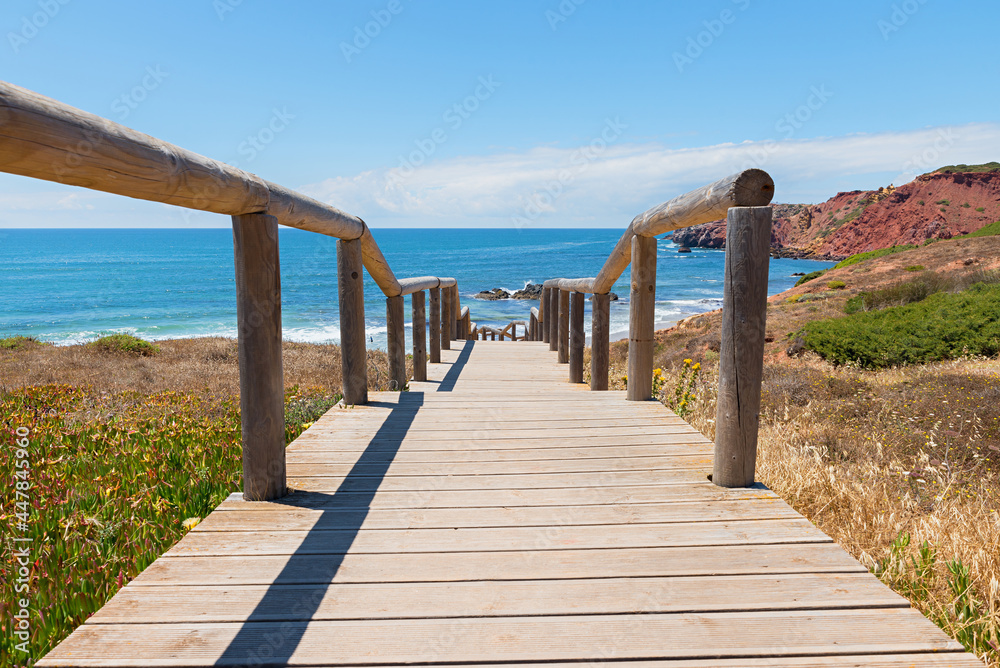 way down to Amado Beach, wooden boardwalk and sea view, west algarve portugal