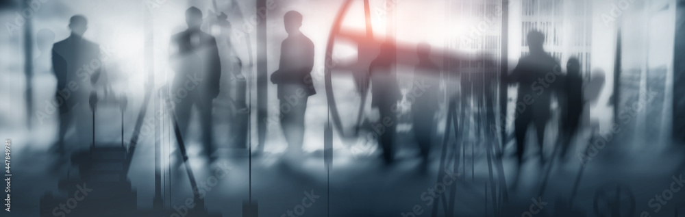 Silhouettes of people on the background of the city and oil rigs Silhouettes of people on the background of the city and oil rigs