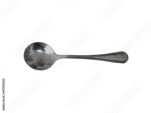 a rounded small stainless steel spoon on white background