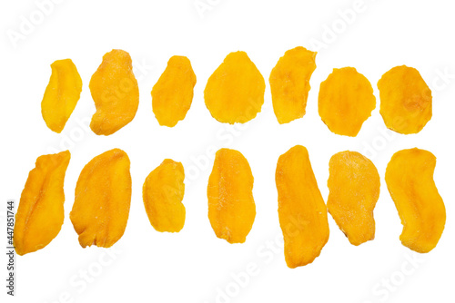 Dry tasty mango slices isolated on a white background.