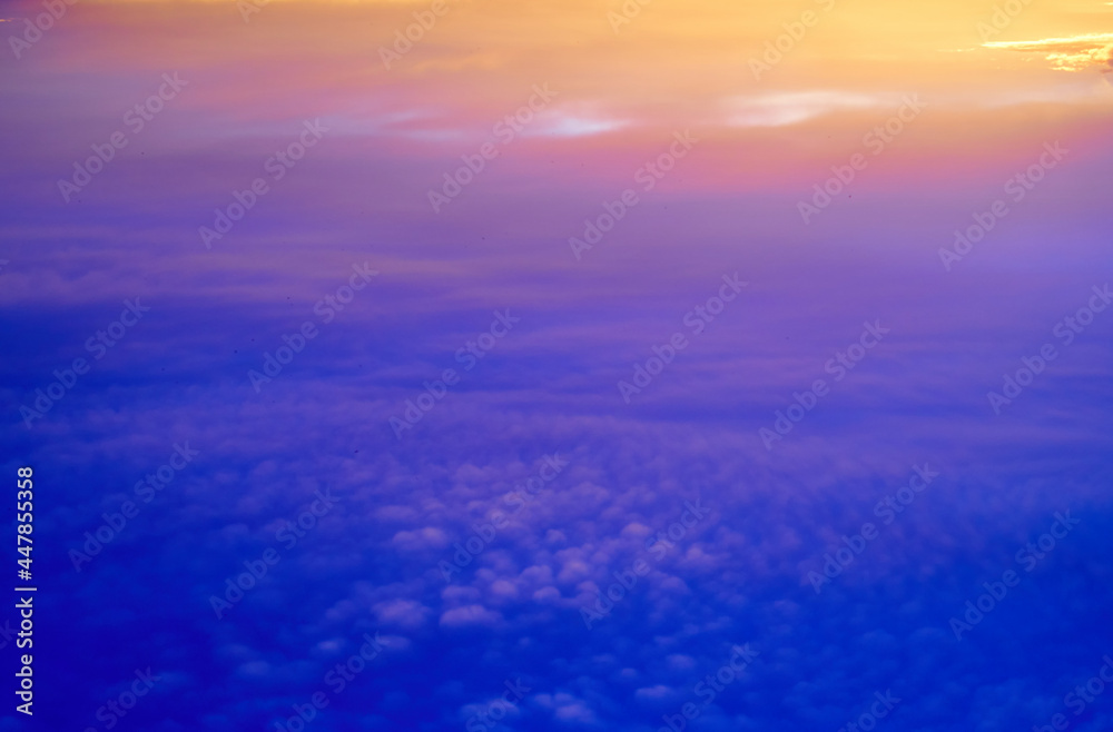 Phantasmagorical vivid colorful cloudscape at sunset time. Abstract nature background.