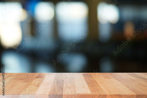 Wooden top with blurred lobby background can be used for mocking up or display product to make advertising.                  photo