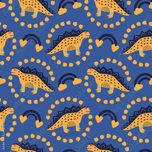 Vector illustration of seamless pattern with a dinosaur. Yellow dino around footprints  rainbow. On a dark blue background. For printing on fabric  for decorating a nursery  digital. Hand-drawn style.