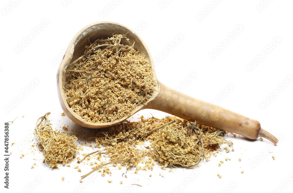 Dried elder flower pile with gourd spoon isolated on white background Dried elder flower pile with gourd spoon isolated on white background