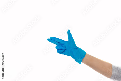 Heart, figure built of hands in blue rubber medical gloves. girl wearing a mask and blue gloves. young woman doing the heart sign