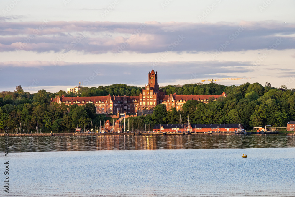 Fototapeta premium The historic building of Marine School in Flensburg at sunset. Schleswig-Holstein in Germany