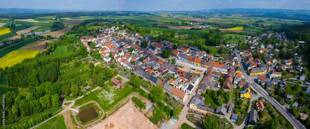 Aerial view of the city Kalchreuth in Germany, on a cloudy day in spring.
