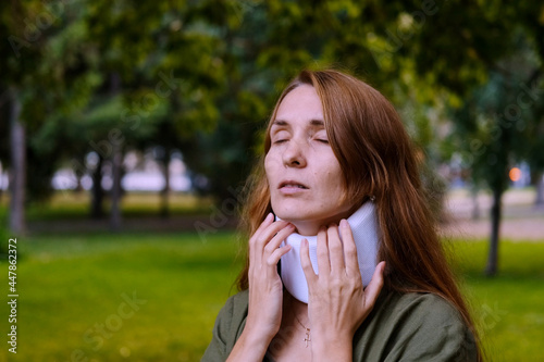 Rotary subluxation atlanta, a woman wears a cervical collar from injury, neck stretching, muscle pain, concussion, sprain of the ligaments, displacement of the vertebrae photo