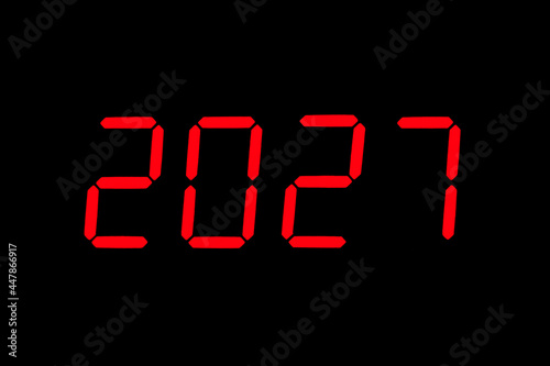 The dial of the electronic clock which shows the year 2027