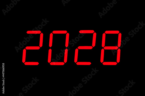 The dial of the electronic clock which shows the year 2028