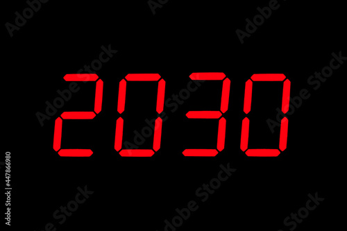 The dial of the electronic clock which shows the year 2030