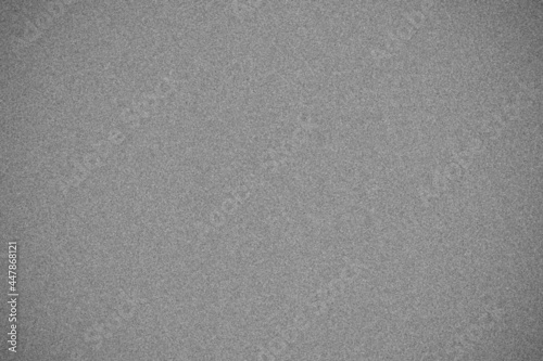 Black and white digital noise surface texture pattern with vignette.