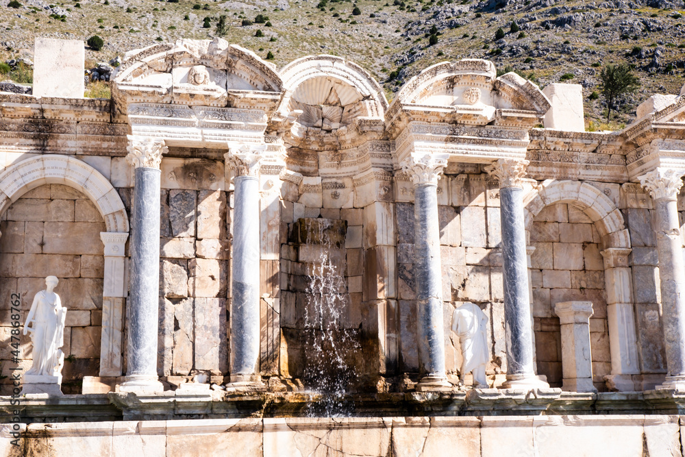 Antonine fountain in the ancient city of Sagalassos. The ancient city, located on the slopes of Akdag, at an altitude of 1700 meters from the sea. Selective focus.