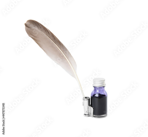 Feather pen and bottle of ink on white background