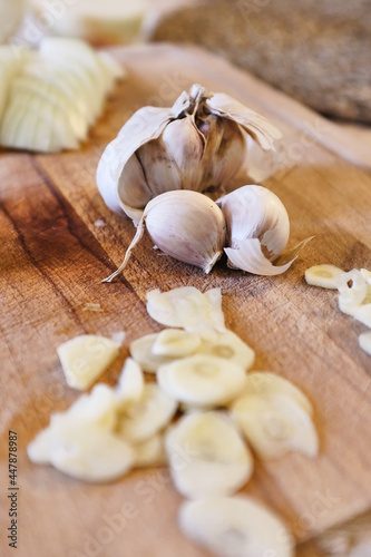 Garlics in a wooden cutting board waiting to be cooked 