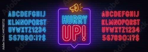 Neon sign hurry up in the speech bubble on brick wall background.