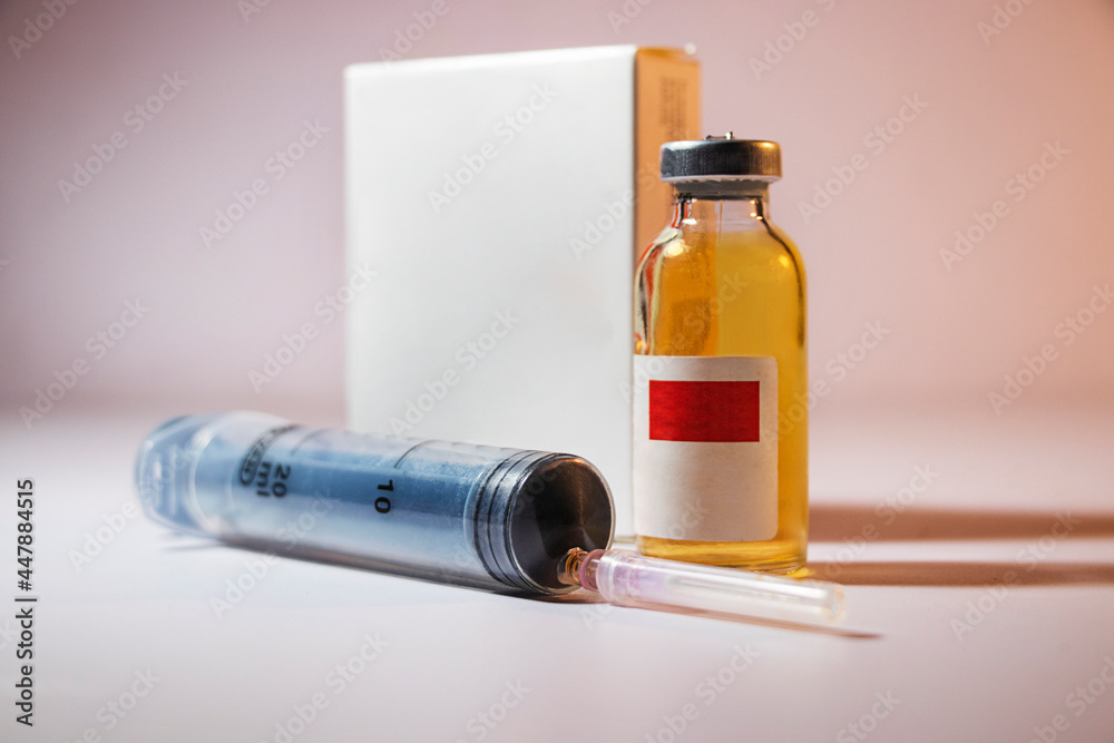 Coronavirus Covid-19 vaccine with syringe isolated on Dark background