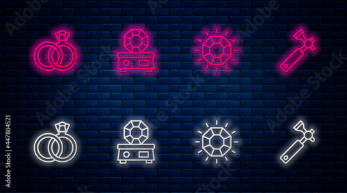 Set line Gem stone, Diamond, Wedding rings and Jewelers lupe. Glowing neon icon on brick wall. Vector