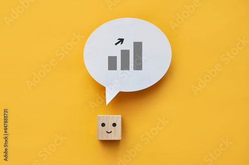 A smiling face and a growing graph above it. The symbol of a successful businessman