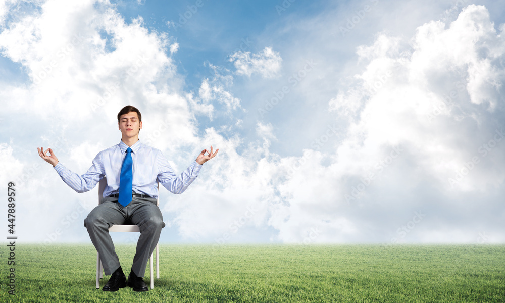 businessman meditates on office chair businessman meditates on office chair