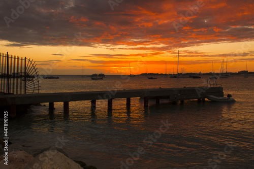 wooden pier against the backdrop of a picturesque sunset sky in Saint Martin  Caribbean sea