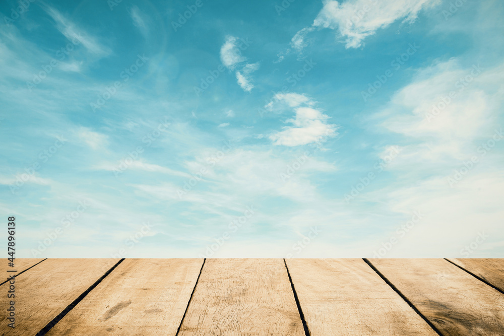 Panoramic empty grunge wood counter table top on blue sky white light bokeh background for product morning scene spring display montage, Abstract Blurry wide wooden desk in kitchen resort hotel.