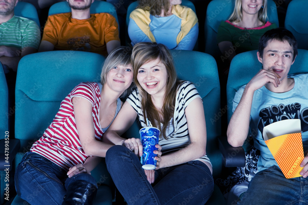 Smiling audience in movie theater