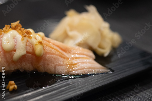 Salmon sushi set topping with mayonnaise sauce.