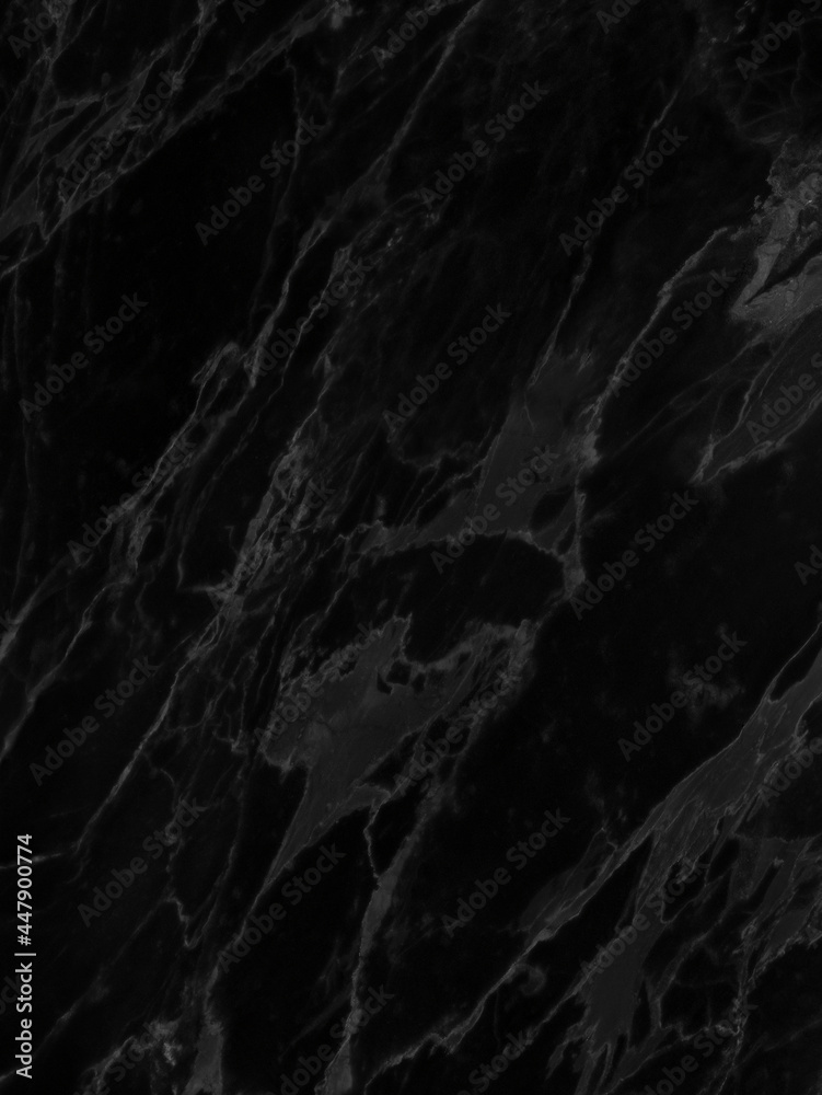 Black marble wall texture. Abstract background with subtle veins. 