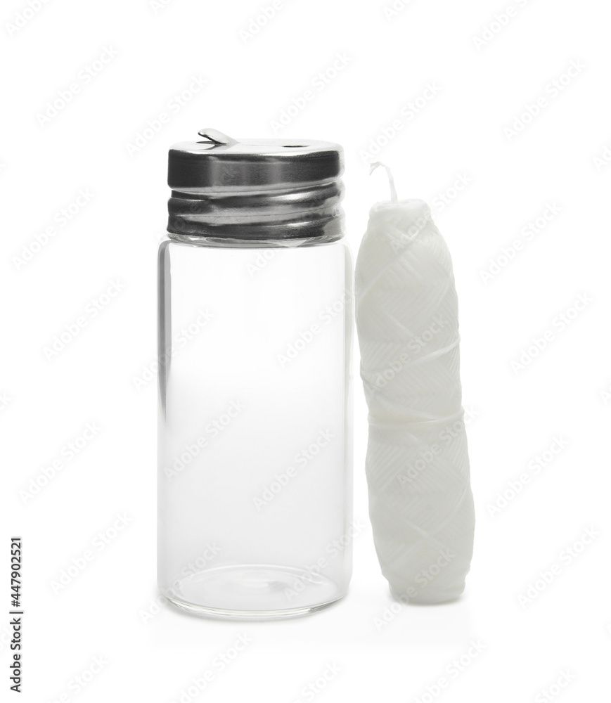 Roll of natural dental floss and jar on white background Roll of natural dental floss and jar on white background