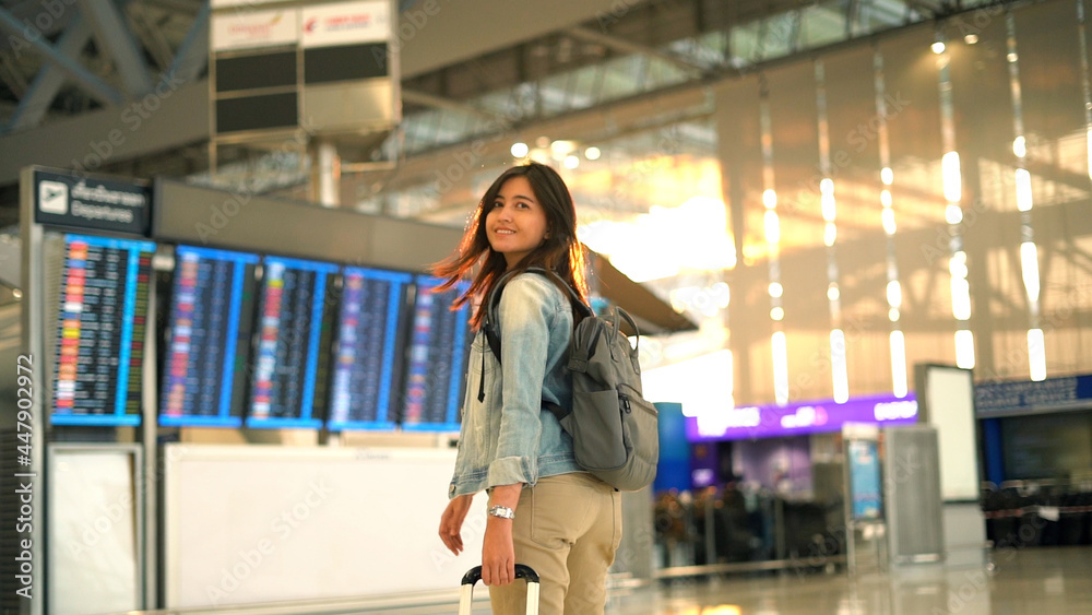 Asian traveler woman walking in airport terminal - obrazy, fototapety, plakaty 