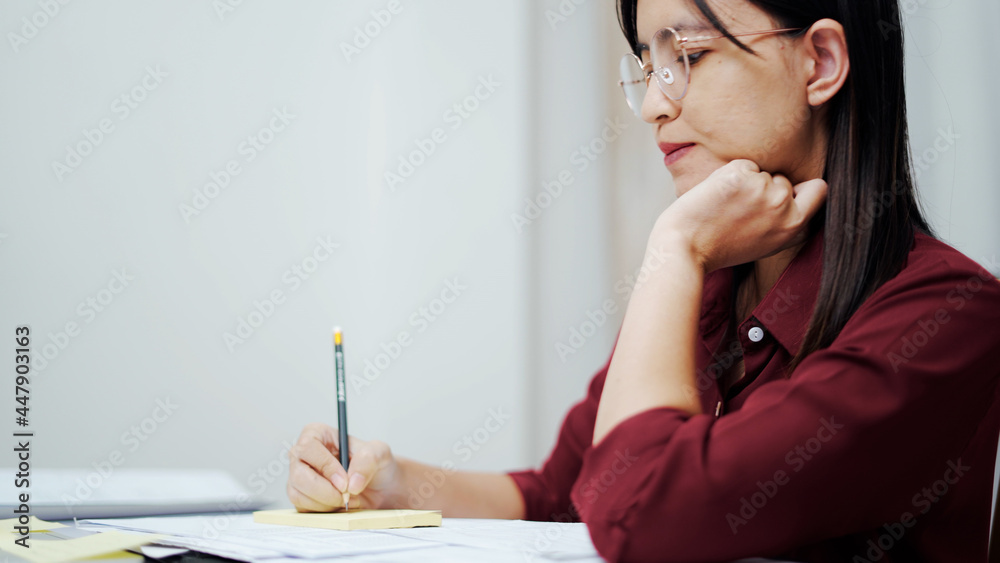 Close up woman hand doing document at home Close up woman hand doing document at home