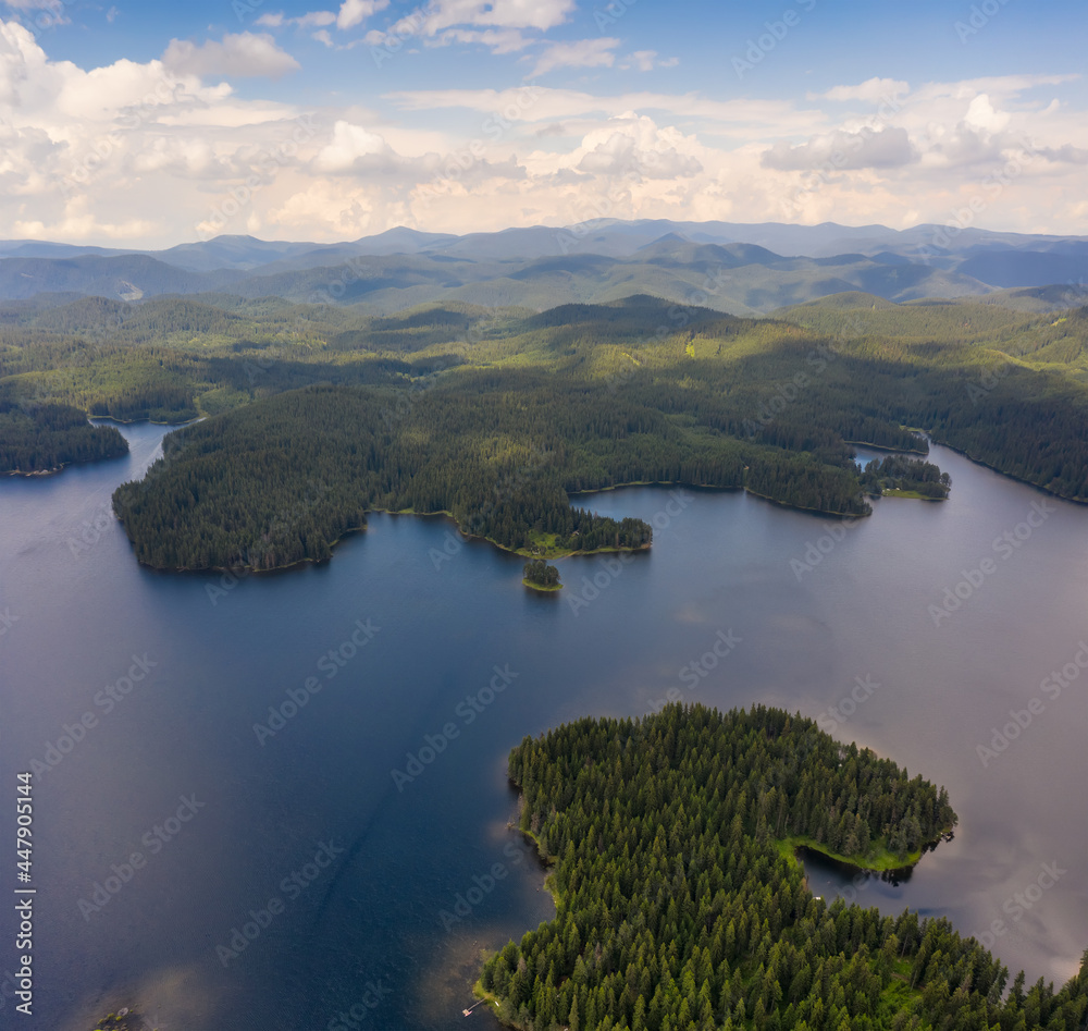 Aerial fly above beautiful lake. A picturesque Shiroka Polyana dam in the Rhodope mountains. Aerial fly above beautiful lake. A picturesque Shiroka Polyana dam in the Rhodope mountains.