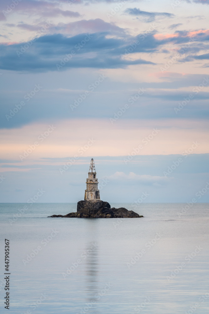 Amazing sunset view with an old lighthouse at the Black Sea coast