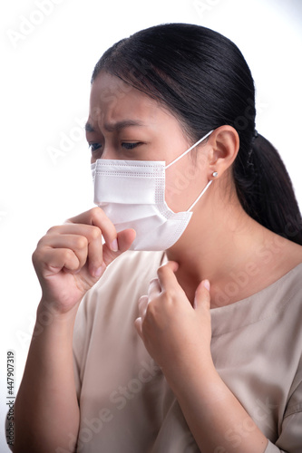 Asian woman is wearing mask on her face against coronavirus or COVID-19 disease. The Pollution Healthcare and virus pandemic concept.