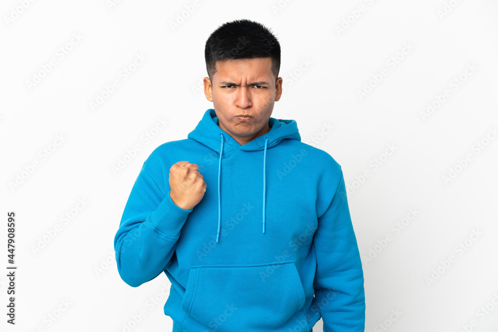 Young Ecuadorian man isolated on white background with unhappy expression Young Ecuadorian man isolated on white background with unhappy expression