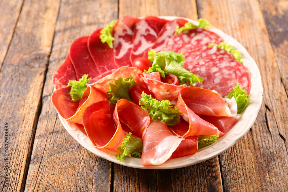 plate with assorted of salami and ham