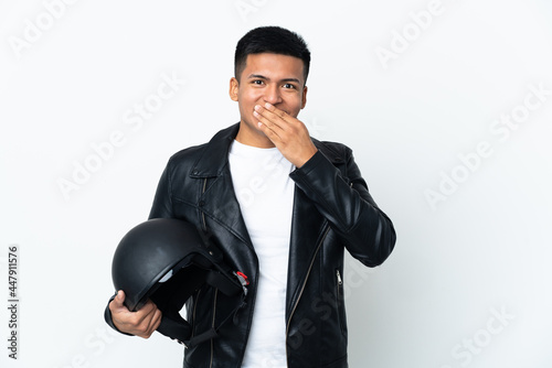 Ecudorian man with a motorcycle helmet isolated on white background happy and smiling covering mouth with hand