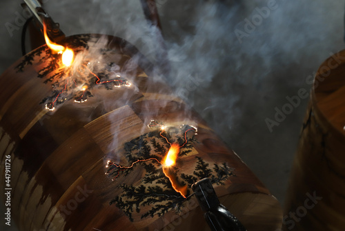 Making art texture on surface of wooden furniture by electric short circuit with baking soda technic .