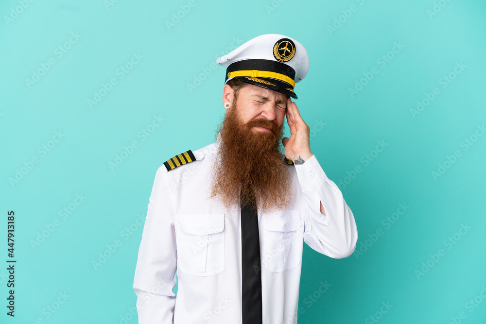 Redhead caucasian man playing rugby isolated on yellow background with headache