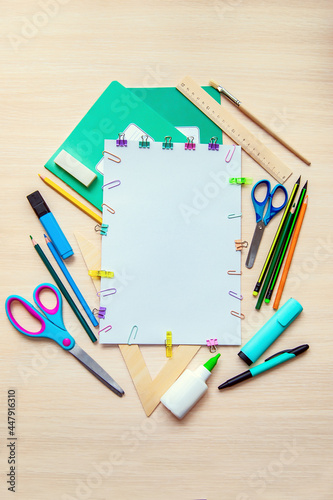 A frame of various stationery on light background, flat lay with space for text. Back to school