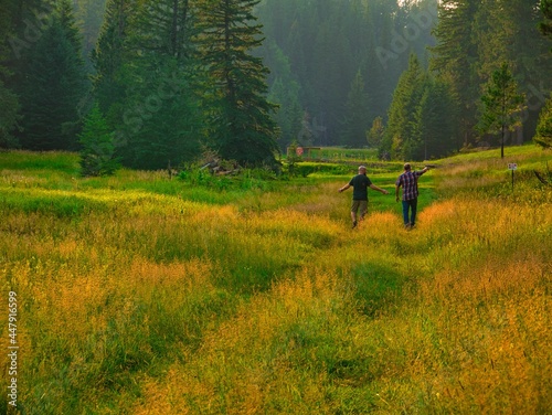 Friends looking and talking in the fields