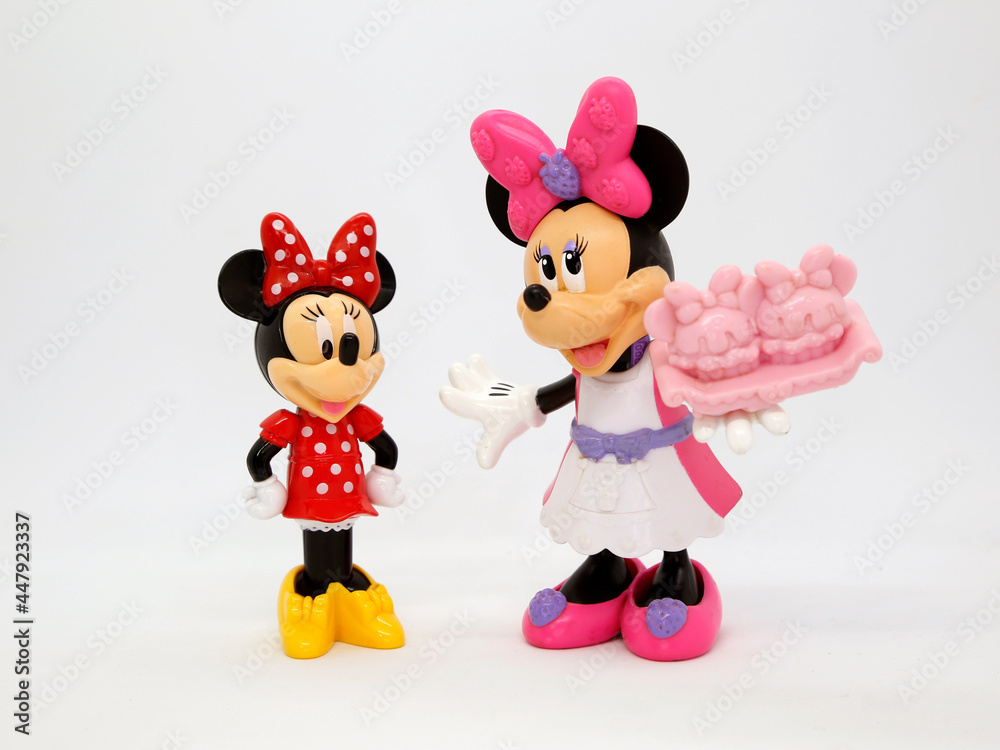 Minnie mouse with her niece and a cake. Toy. Cartoon characters from Walt  Disney Pictures Studios. Minnie is Mickey Mouse's girlfriend. Doll with  interchangeable clothes. Isolated white. Stock Photo | Adobe Stock