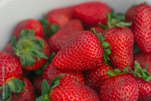 white bowl with fresh strawberries